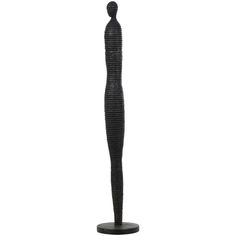 a tall black sculpture on a white background