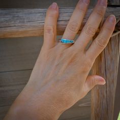 This Unique Ring Is Handcrafted With Sterling Silver And Features 5 Vivid Turquoise Cobblestone Inlaid Stones. The Slightly Elevated Setting Is 3/16" Wide And Tapers To 1/8". Wear This Distinctive Ring Alone Or Stacked With Other Favorites For An Authentic Southwestern Style. Size: 7 Stamped: Sterling Artist Stamped: At Free Domestic Shipping Turquoise Ring With Accent Stones For Promise, Everyday Sterling Silver Turquoise Ring, Stackable Blue Turquoise Ring In Sterling Silver, Blue Opal Ring With Accent Stones, Southwestern Style, Unique Ring, Stacking Ring, Native American Jewelry, Silver Turquoise