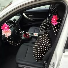 the interior of a car decorated with polka dots and pink flowers