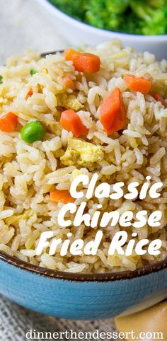 a close up of a bowl of rice with carrots and broccoli in the background