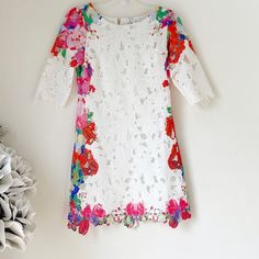 This Gorgeous Floral Dress With Beautiful Details Is By Chic Wish. Features: Lovely Floral Details, Lined, Round Neckline, Hidden Back Zipper And 3/4 Sleeves. Material Tag Missing. Chicwish Nwt Med White W/Floral Details Cotton/ Poly Lining Approx Measurements: Pit To Pit: 16” Waist: 15” Length: 34 1/2” Bundle To Save More Multicolor Party Dress With 3/4 Sleeves, Multicolor 3/4 Sleeve Party Dress, Spring Lace Dress With Half Sleeves, Spring Lace Dresses With Half Sleeves, Spring Half-sleeve Lace Dresses, Multicolor Lace Dresses For Spring, Summer Lace Dress With 3/4 Sleeves, Summer 3/4 Sleeve Lace Dress, Chicwish Dress