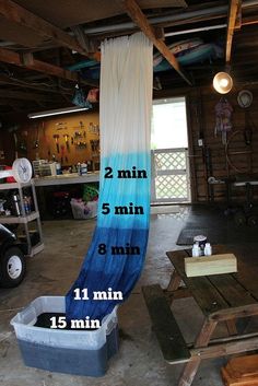 a blue and white hammock hanging from the ceiling in a garage with instructions for how to measure it