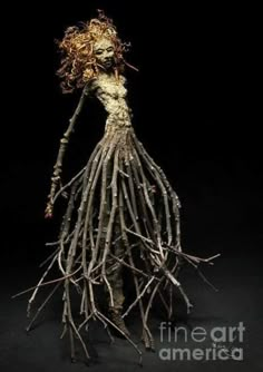 a doll made out of branches and twigs