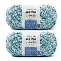 two balls of yarn in blue and white