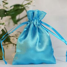 "View All Colors : https://etsy.me/3li6E8D Quantity: 12 Satin Bags Material: Satin Color: Turquoise Height: 4\" Width: 3\" Thickness: 90 GSM Fillable Size: 3\" x 3.5\" Perfect for packaging jewelry, candies, or gifts. Drawstring Pouch Wave like modish pattern coupled with rustic burlap hue and texture give these favor bags a classic whimsical appeal. Pack wine bottles, decorative jars or pots, pillar candles, and other sweet surprises and secure with two double pull ribbon knots at the end for s Turquoise Wedding Decorations, Cheap Party Favors, Favor Table, Handmade Candy, Special Events Decor, Custom Gift Bags, Silk Jewelry, Turquoise Wedding, Satin Bags