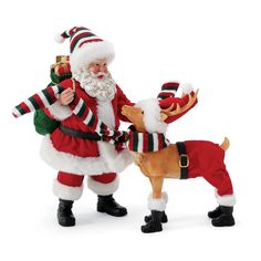 santa claus and his reindeer are posed together