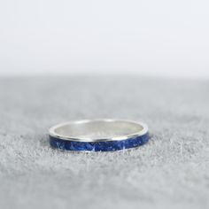 Silver Lapis Lazuli Ring Silver Lapis Lazuli Ring Features Sterling Silver Channel Ring 3.2mm Wide 100% Natural Crushed Lapis Lazuli Mixed With Resin Inside The Inlay Silver Lapis Lazuli Ring Benefits Includes a jewelry care card Includes a jewelry polishing pad (these are like magic!) Stacks great with other rings! Arrives ready to gift in a beautifully packaged box Free standard domestic shipping Insurance included Free returns & exchanges ☂ Our crushed powders are mixed with epoxy and cannot Blue Hypoallergenic Rings For Anniversary, Hypoallergenic Blue Rings For Anniversary, Jewelry Care Card, Channel Ring, Casper Wyoming, Metaphysical Jewelry, Lapis Lazuli Ring, Care Card, Polish Jewelry