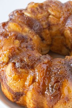 a bundt cake on a white plate with caramel topping