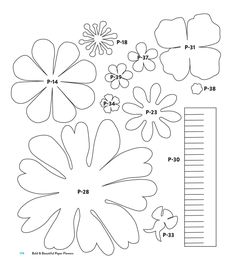 flowers cut out from paper and measuring rulers to make them look like they are in the