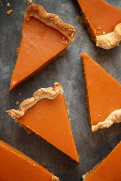 several slices of pumpkin pie on a baking sheet