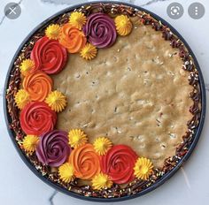 a cake decorated with flowers and sprinkles