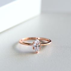 ✩ Made of solid sterling silver/14K rose gold vermeil/14k yellow gold vermeil. Allergy-free. Tarnish resistant. ✩ Heavy gold plating adds extra shine and ensure durability ✩ Main stone carat weight: 0.5 ct (4x8mm) ✩ Shank width 1.1 mm ✩ Approx. weight: 1.2g ✩ Ship beautifully packaged Matching band: https://www.etsy.com/listing/596398085/sterling-silver-chevron-ringrose-gold * Social media * Find us on Facebook: https://www.facebook.com/joylenejewelry/ Tag us on Instagram: joylenedesign Rose Gold Sterling Silver Stackable Promise Rings, Promise Midi Rings In Rose Gold With Ethical Diamonds, Rose Gold Solitaire Stackable Rings Gift, Rose Gold Solitaire Midi Rings As Gift, Classic Rose Gold Midi Rings, Delicate Rose Gold Sterling Silver Crystal Ring, Rose Gold Solitaire Midi Rings For Anniversary, Rose Gold Sterling Silver Diamond Promise Ring, Anniversary Rose Gold Solitaire Midi Rings