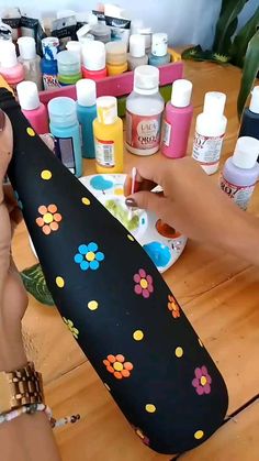 the woman is painting her body with acrylic paint