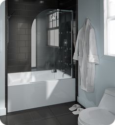 a white bath tub sitting next to a toilet