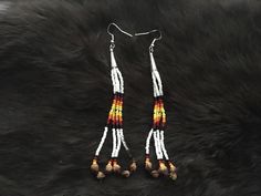 Authentic Beautiful Native American Indian Jewelry Navajo Hand Beaded Long Dangle Earrings with "Ghost Beads" Great for a gift❤️ Handcrafted by Navajo Artist R. Sellers These beautiful earrings are approximately 4.5" in length and 1" in width. Ghost Beads Represent interconnection with the earth, trees, animals and humans. Wear it to bring about peace, harmony and safety. It wards off negative energy, bringing about protection from evil spirits, ghosts and nightmares. Give them as gifts or buy for yourself! Protection From Evil Spirits, Indian Jewelry Earrings, American Indian Jewelry, Southwestern Jewelry, Long Dangle Earrings, Evil Spirits, Native American Indians, American Indian, Hand Beading