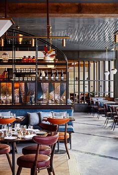 an empty restaurant with many tables and chairs