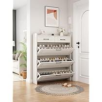 a white shoe rack sitting on top of a hard wood floor next to a doorway