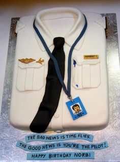 a birthday cake with a shirt and tie on it