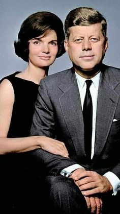 an older man and young woman posing for a portrait