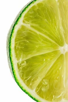 a lime cut in half on a white background