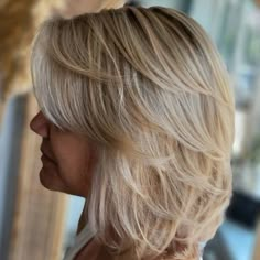 Blonde Lob with Feathered Layers Medium Hair Styles For Women Over 50 Layered Bobs, Feathered Hairstyles For Fine Hair, Medium Feathered Hair, Super Layered Hair Short, New Hairstyles For 2023 Women, Feathered Shag Layered Hairstyles, Shoulder Length Layered Bob With Bangs, Feathered Short Hair, Bob Hairstyles Medium Length