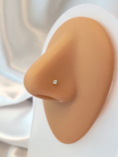 a close up view of a ring on a mannequin's head