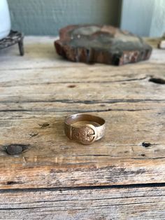 Lovely 9K gold ring. It features a a buckle design. Mark: G.P.S. (maker's mark) .375 (9K gold) Date letter P - (either 1914 04 1939) Anchor (pictorial) Birmingham My sterling and silver items are all with the original patina as when I acquired them. I leave the polishing up to the buyer. *Please visit my shop to find other great vintage items. https://www.etsy.com/shop/SionainnRiverVintage A picture is worth 1000 words. I work very hard to provide you with accurate, detailed pictures of the item Ring With Letter, Gold Ring Band, Marissa Meyer, Silver Items, Buckle Ring, Birmingham England, Letter P, Gold Band Ring, Detailed Pictures