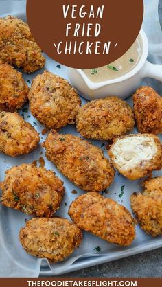 chicken nuggets on a plate with ranch dressing in the background and text overlay that reads vegan fried chicken