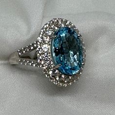 Captivating Swiss Blue Topaz With A Double Halo Of Beautiful Zircons Set In Platinum Over Sterling Silver. I Saw A Very Similar Ring With Only 5 Ctw At Zales Set In Sterling Silver Only On Sale Last Week For $179.00. This Ring Is 10.65 Ctw And Has Platinum Over The Sterling Silver. Stunning!!!! Nwot, Happy Poshing!!!!! Luxury Blue Topaz Ring With Vs Clarity, Formal Blue Topaz Ring With Vs Clarity, Dazzling Blue Topaz Ring For Formal Occasions, Blue Topaz Ring For Formal Events, Double Halo, Swiss Blue Topaz, Blue Topaz, I Saw, Topaz