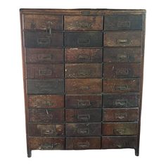 an old wooden chest with many drawers