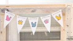 there are three bunting banners with animals on them