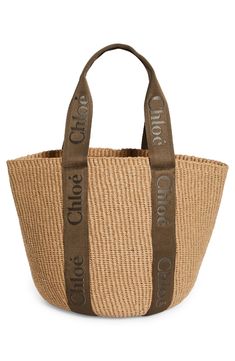 Chloé's classic logo stands out at the sturdy canvas straps of a roomy tote woven from straw for a beachy-keen aesthetic. Open top Top carry handles Unlined Textile Made in Spain Designer Handbags This brand has B Corp certification, representing business practices with emphasis on social and environmental performance, accountability and transparency This brand meets Nordstrom Responsible Brands criteria: brand adheres to responsible social and environmental practices Large Shopper Bag, Raffia Basket, Louis Vuitton Logo, Large Basket, Chloe Handbags, Basket Tote, Straw Basket, Embroidered Canvas, Model Features