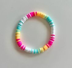 a bracelet made out of multicolored plastic beads