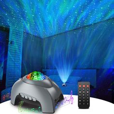 there is a remote control and an image of a room with stars on the ceiling