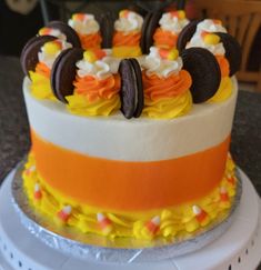 a decorated cake with cookies and candy on top