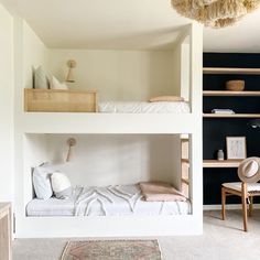 a bedroom with two bunk beds and a rug on the floor