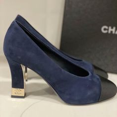 These Navy Blue Suede Pumps Feature A Pointed Black Grosgrain Cap Toe. Suede Square 3.5" Heel With Goldtone Metal Cc Embossed Detail. Padded Leather Insole And Leather Sole. Made In Italy. Designer Color: Navy Blue/Black. Size: 37 Eu (Insole Measures 9 5/8", Heel: 3.5"). Typically Chanel Shoes Run Small. Brand New With The Box. Luxury Suede Court Shoes With Padded Heel, Luxury Court Shoes With Round Toe Medium Width, Luxury Medium Width Round Toe Court Shoes, Luxury Medium Width Closed Toe Court Shoes, Luxury Medium Width Court Shoes With Round Toe, Designer Closed Toe Heels With Rubber Heel Cap, Designer Round Toe Court Shoes With Contrasting Heel Counter, Designer Court Shoes With Branded Heel And Round Toe, Designer Court Shoes With Reinforced Heel