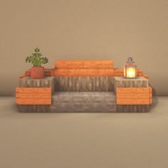 an orange couch sitting next to a potted plant on top of a wooden table