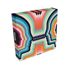 a colorful box with an abstract design on the front and sides, that says wavelight