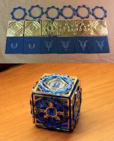 a blue and gold object sitting on top of a wooden table