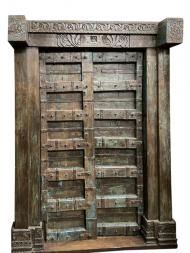 an old wooden door with carvings on it