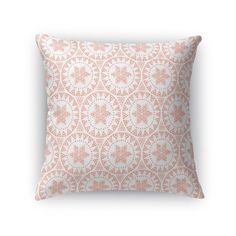 a pink and white pillow with an intricate design