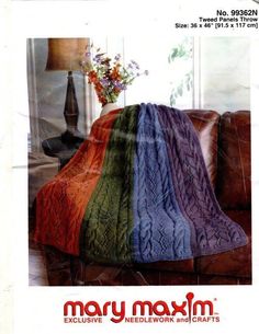 an advertisement for mary moxm's afghans and throws, featuring a multicolored blanket