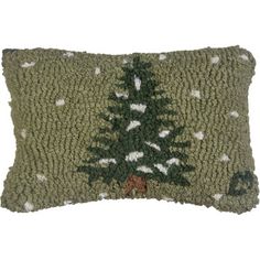 a green christmas tree pillow on a white background