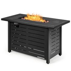 an outdoor fire pit is shown with flames on it's sides and the lid open