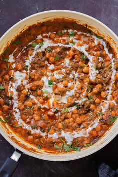 a large pot filled with food on top of a table