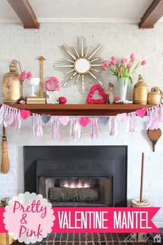 a fireplace decorated for valentine's day with pink and gold decorations on the mantle