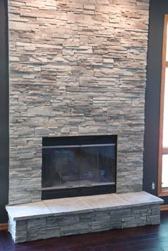 a large stone fireplace in a living room