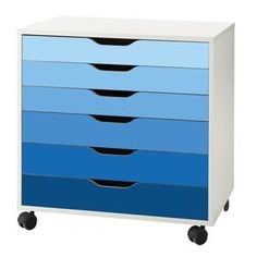 a blue and white dresser on wheels with four drawers in the bottom drawer, front view