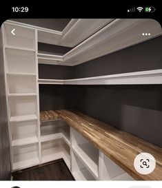 an image of a closet with shelves and shelvings on the bottom shelf in front of it